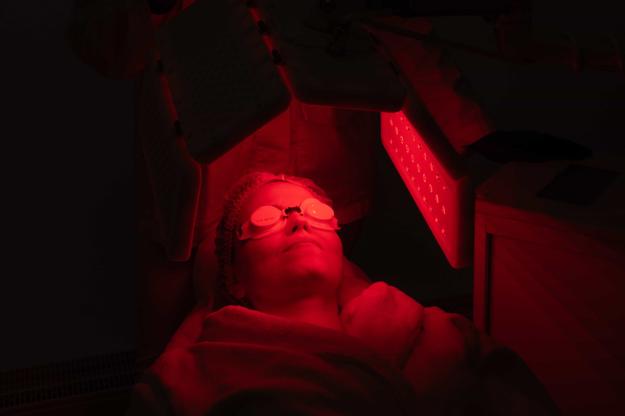 A guest during a red light therapy session
